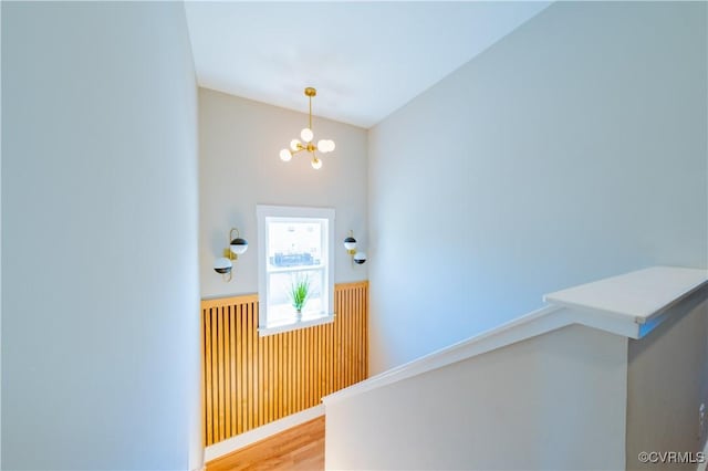 300 W 25th St, Richmond, VA 23225 - entryway with a wainscoted wall, wood finished floors, and a notable chandelier