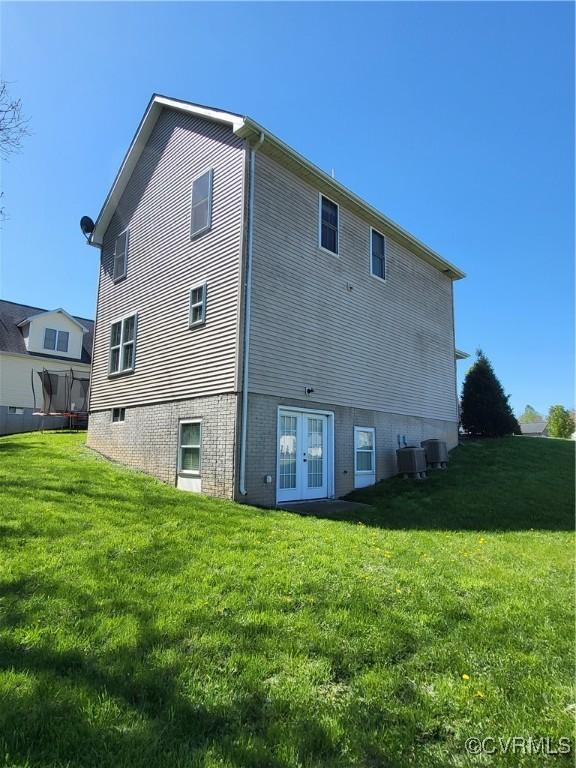640 Coniston Manor Dr, Gordonsville, VA 22942 - rear view of house featuring a lawn, french doors, and cooling unit