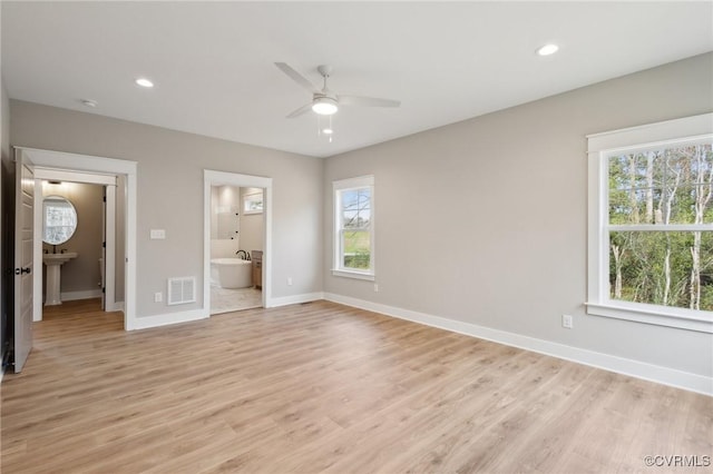 unfurnished bedroom featuring baseboards, visible vents, recessed lighting, and light wood-style floors