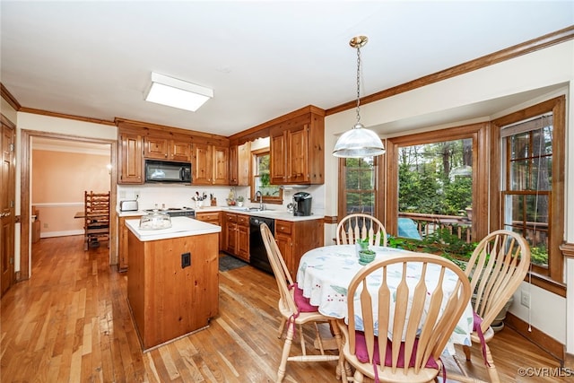 3112 Brookemoor Ct, Glen Allen, VA 23060 - kitchen with light countertops, a kitchen island, crown molding, baseboards, and black appliances