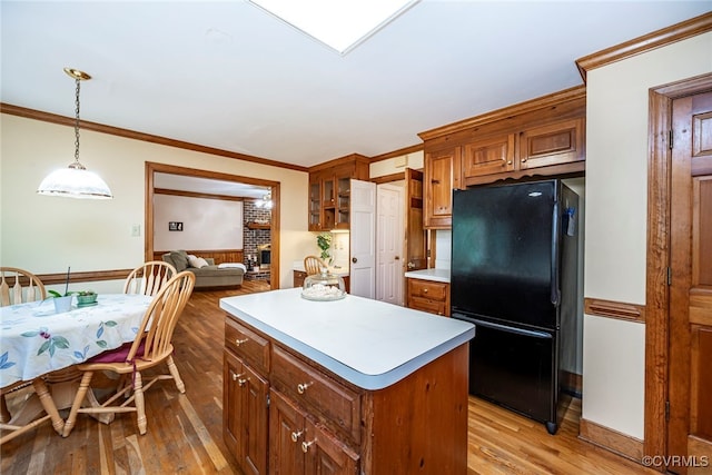 3112 Brookemoor Ct, Glen Allen, VA 23060 - kitchen with light wood-type flooring, light countertops, freestanding refrigerator, and a kitchen island