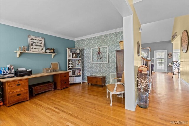 office space with an accent wall, wallpapered walls, and wood finished floors