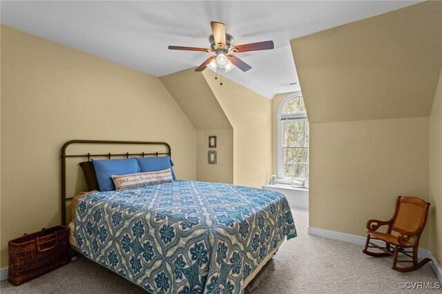 carpeted bedroom featuring baseboards, a ceiling fan, and vaulted ceiling