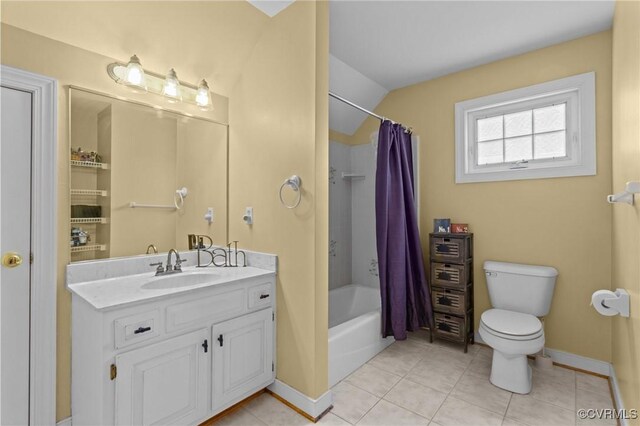 bathroom featuring tile patterned flooring, shower / tub combo with curtain, vanity, toilet, and vaulted ceiling