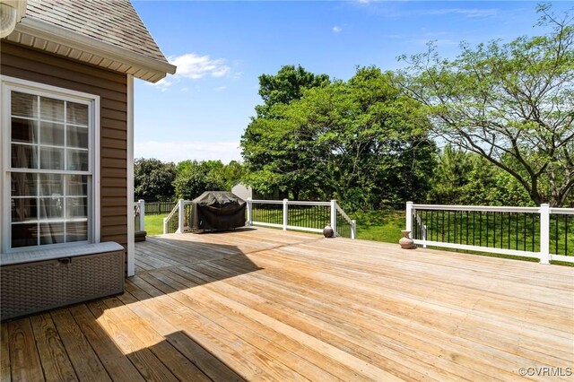 deck featuring a grill