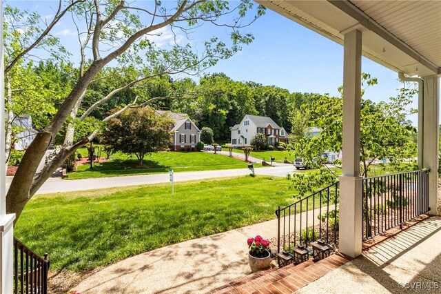 view of patio featuring a porch and a residential view