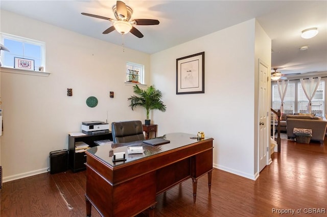 home office with a healthy amount of sunlight, a ceiling fan, and baseboards