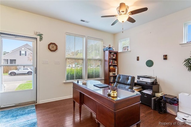 office space featuring baseboards, visible vents, a ceiling fan, and dark wood-style floors