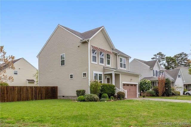 view of side of home with concrete driveway, fence, and a lawn