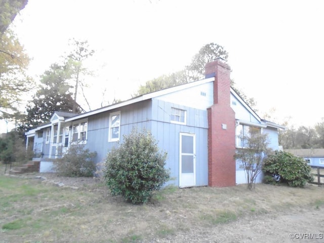 view of home's exterior featuring a chimney
