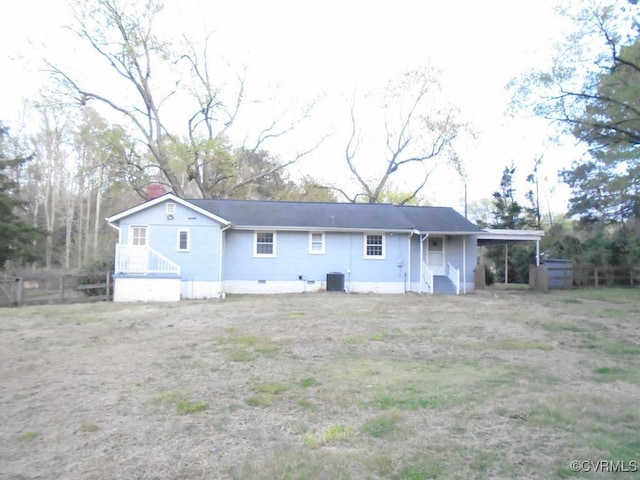 rear view of house with fence