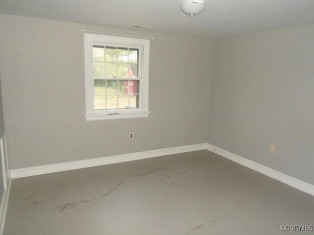 empty room featuring baseboards