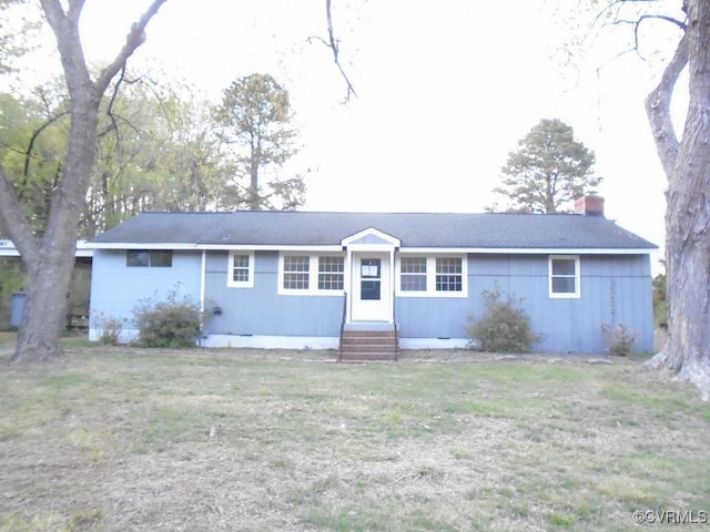 ranch-style house with a chimney and entry steps