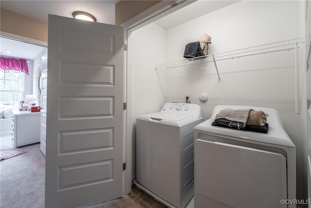 laundry room featuring laundry area, washer and clothes dryer, and carpet floors