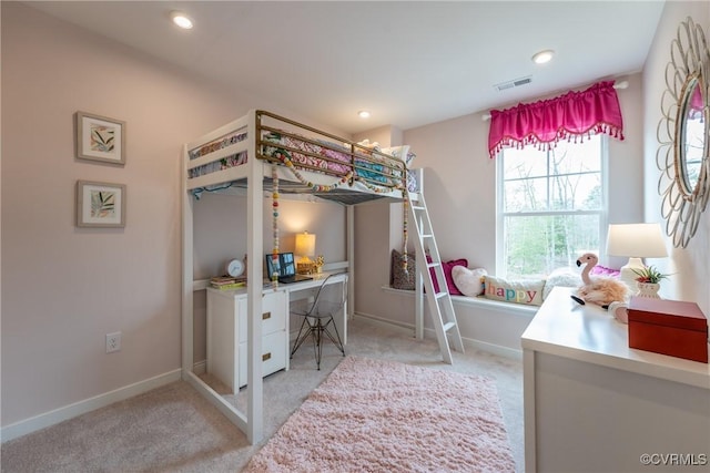 bedroom with visible vents, baseboards, and light carpet