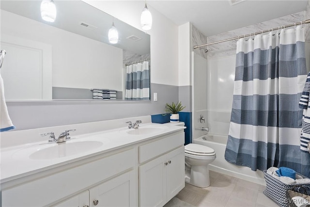 full bathroom with double vanity, shower / bath combo with shower curtain, and toilet