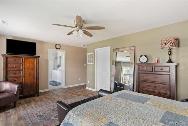 bedroom with wood finished floors, baseboards, connected bathroom, and a ceiling fan