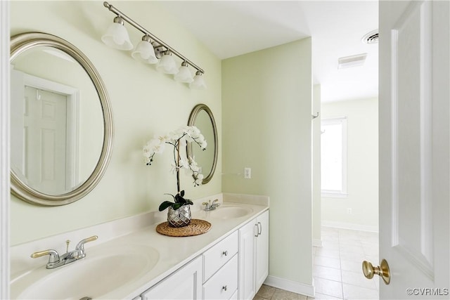 full bath featuring tile patterned floors, a sink, visible vents, and double vanity