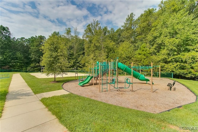 communal playground featuring fence and a yard