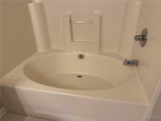 bathroom featuring tile patterned flooring and a bathing tub