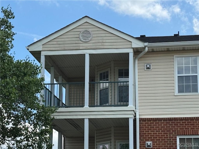 view of home's exterior featuring a balcony