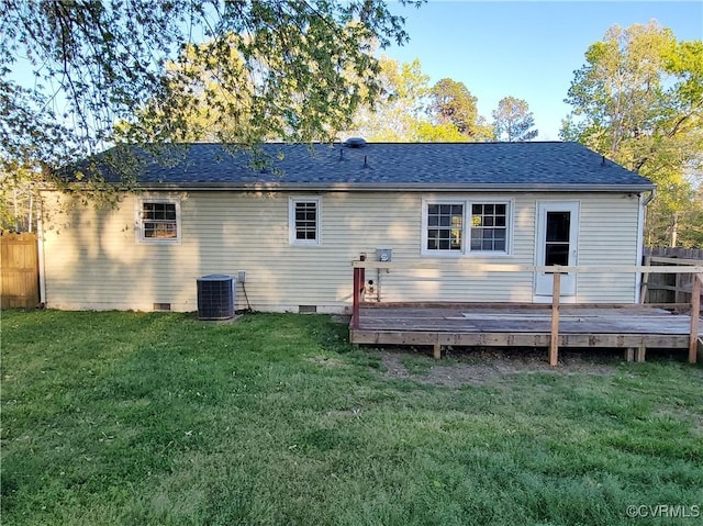 rear view of property featuring a yard, central air condition unit, crawl space, and a deck