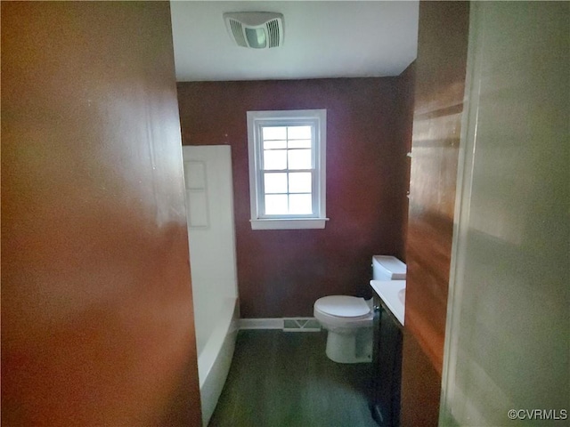 bathroom with baseboards, visible vents, vanity, and toilet