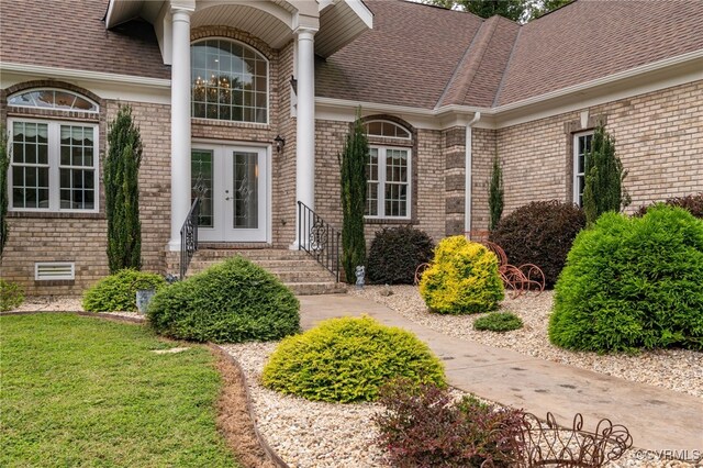 2403 Bermuda Ave, Chester, VA 23836 - entrance to property featuring brick siding, roof with shingles, and french doors