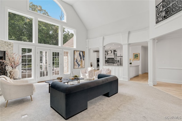 2403 Bermuda Ave, Chester, VA 23836 - living room with decorative columns, french doors, high vaulted ceiling, and light colored carpet