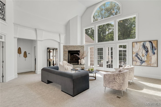 2403 Bermuda Ave, Chester, VA 23836 - living room featuring carpet, baseboards, high vaulted ceiling, and a fireplace with raised hearth