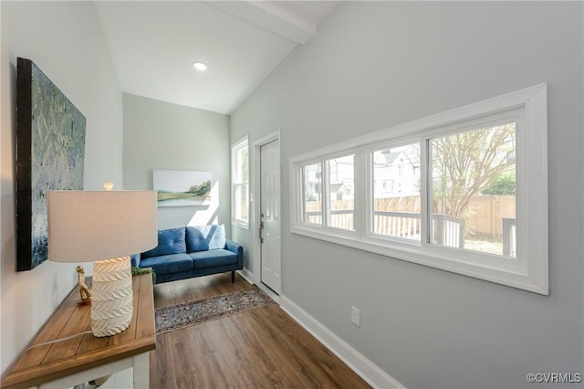 interior space with lofted ceiling with beams, baseboards, wood finished floors, and recessed lighting