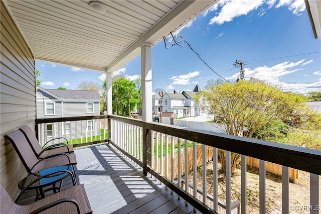 wooden terrace featuring a residential view