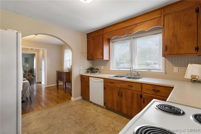 16 Lakeview Dr, Newport News, VA 23602 - kitchen featuring white appliances, light countertops, healthy amount of natural light, and arched walkways