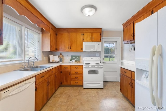 16 Lakeview Dr, Newport News, VA 23602 - kitchen featuring white appliances, tasteful backsplash, light countertops, and brown cabinets