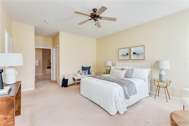 bedroom featuring a ceiling fan, baseboards, and light carpet