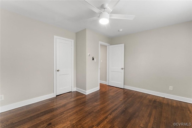 unfurnished bedroom featuring wood finished floors, a ceiling fan, and baseboards