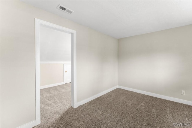 carpeted empty room with baseboards and visible vents
