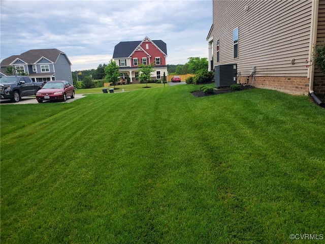 view of yard featuring central AC unit