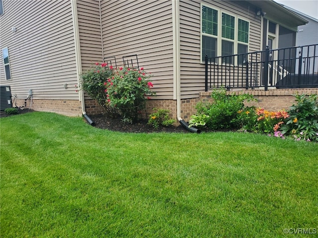view of yard with central air condition unit