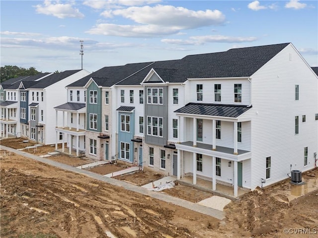 15345 Sunray Aly, Chesterfield, VA 23832 - townhome / multi-family property featuring a standing seam roof, metal roof, a residential view, central AC unit, and covered porch
