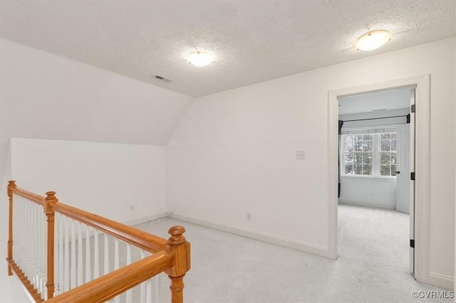 11107 Lyndenwood Dr, Chesterfield, VA 23838 - additional living space featuring baseboards, a textured ceiling, and light colored carpet