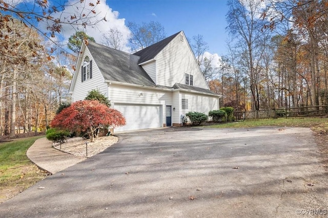 11107 Lyndenwood Dr, Chesterfield, VA 23838 - view of property exterior with a garage, aphalt driveway, and fence