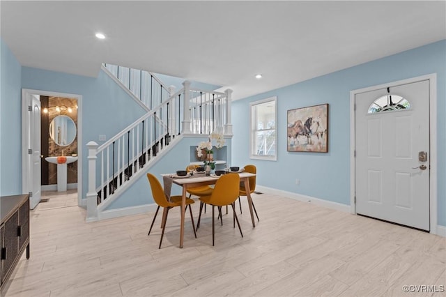 6512 River Rd, South Chesterfield, VA 23803 - dining space featuring baseboards, wood finished floors, stairs, and recessed lighting