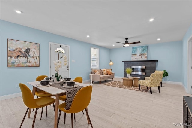 6512 River Rd, South Chesterfield, VA 23803 - dining area with a glass covered fireplace, light wood-type flooring, ceiling fan, baseboards, and recessed lighting