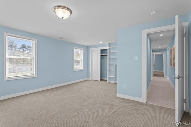 6512 River Rd, South Chesterfield, VA 23803 - unfurnished bedroom featuring visible vents, baseboards, a closet, and light colored carpet