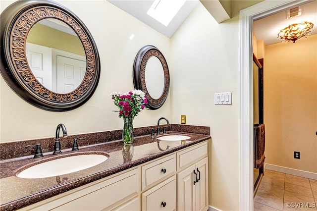 bathroom featuring a sink, tile patterned floors, double vanity, and visible vents