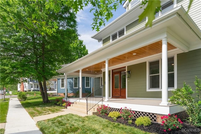 doorway to property with a porch