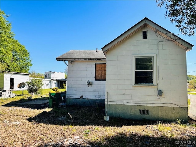 view of side of property with crawl space
