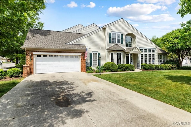 view of front of property featuring an attached garage, a shingled roof, a front yard, brick siding, and driveway