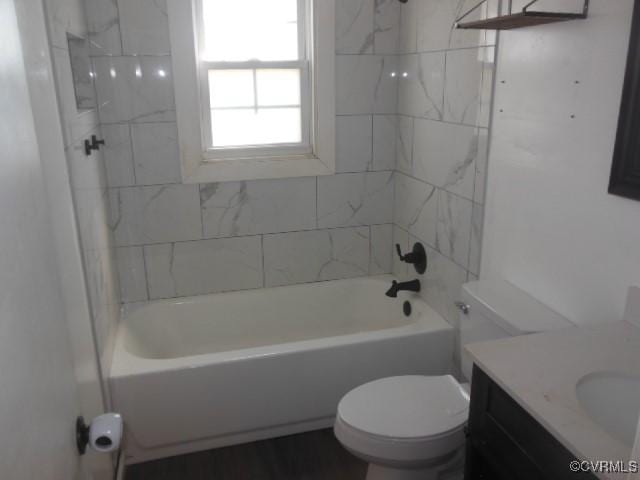 bathroom with toilet, vanity, and shower / bath combination